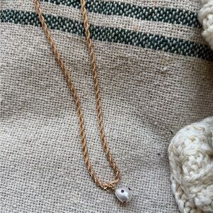 Urban Outfitters Gold Necklace with White and Red Bead